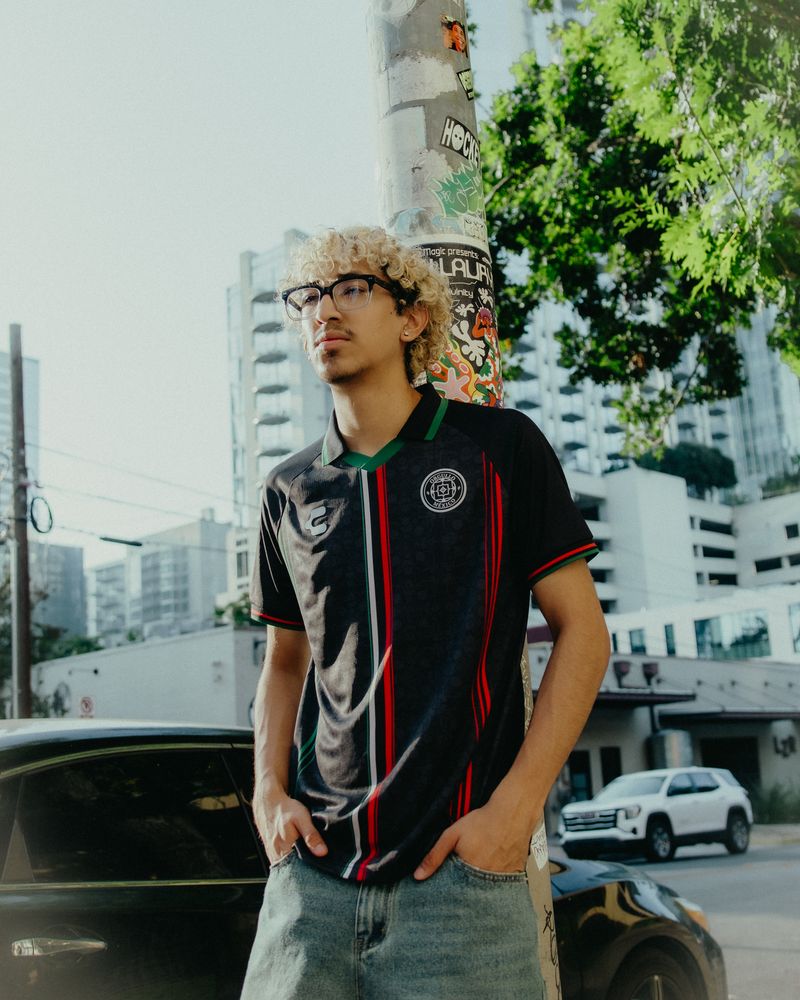 Model in a black Charly jersey on a downtown Austin street