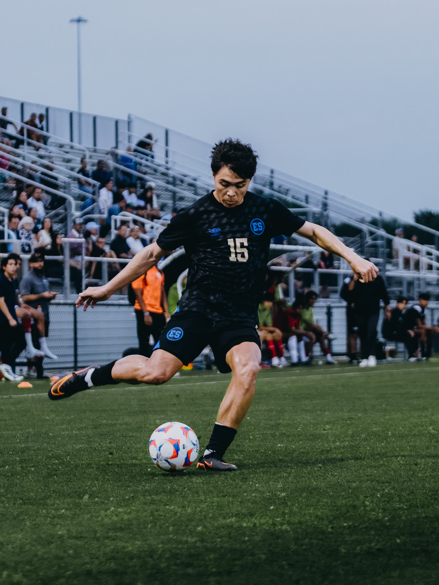 El Salvador player striking the ball